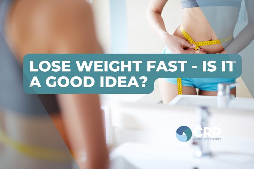 Photo of a woman looking in a bathroom mirror with a tape measure around her waist with the caption "lose weight fast - is it a good idea?"